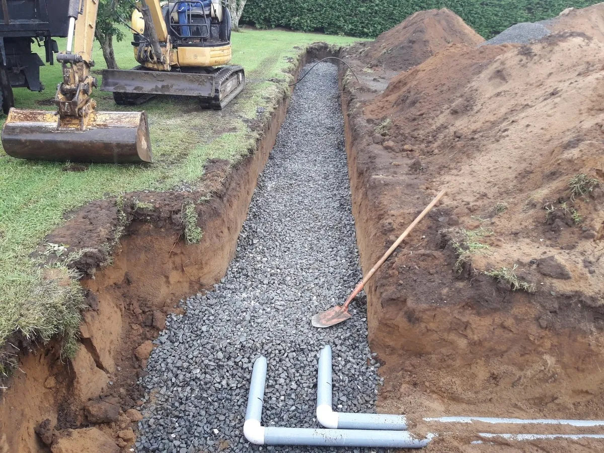 Digger and operator on a Plumbtech Waikato job
